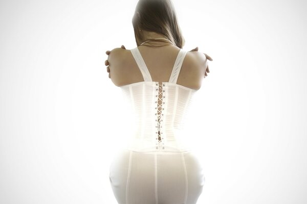 Fille sexy en lingerie blanche carset de l arrière