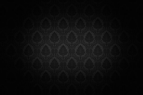 Un faisceau de lumière est dirigé vers un mur avec un papier peint noir