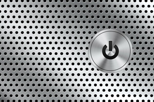 Bouton sur le panneau métallique avec des trous