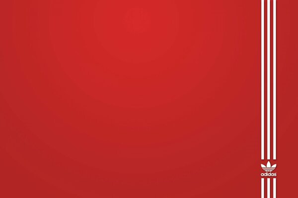 Logo Adidas sur fond rouge