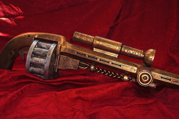 Revolver en bronze sur velours rouge