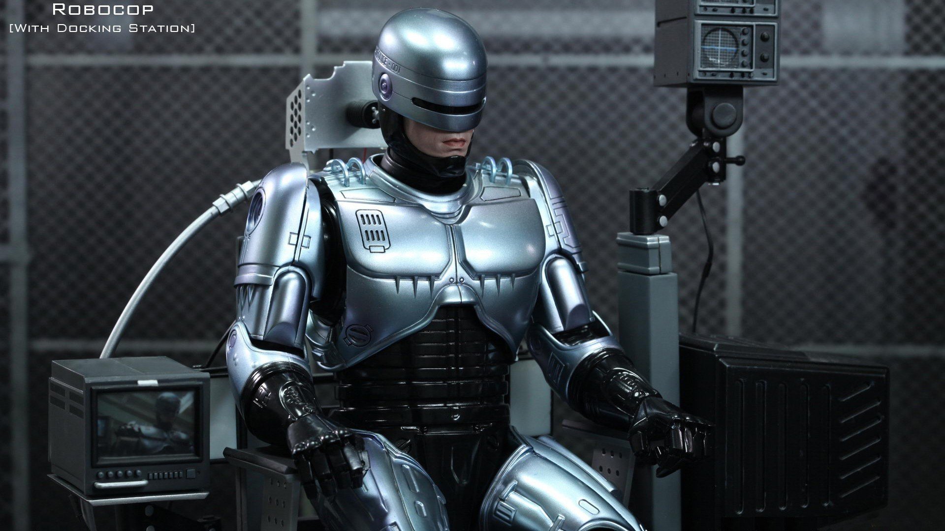 robocop héros cyborg robot policier fer armure assis recharge