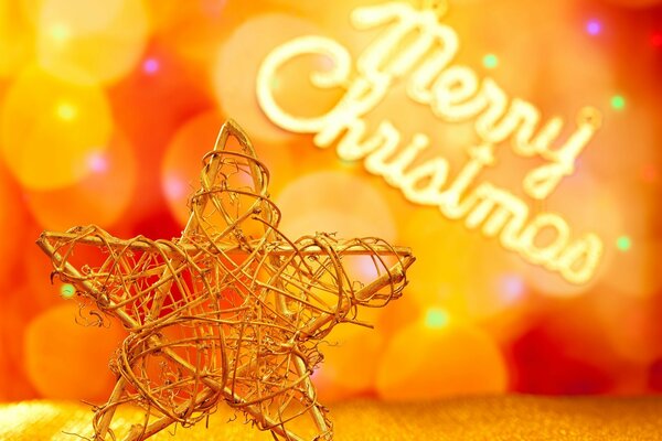 Jouet de Noël en métal-étoile sur fond de bokeh et lettrage joyeux Noël